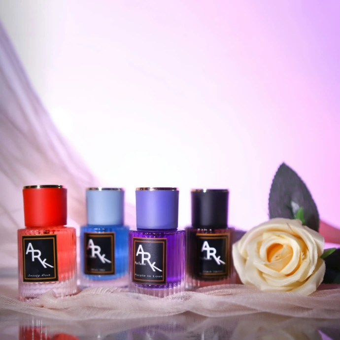 Perfumes and a rose are displayed in this image.